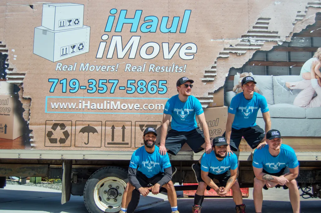 iHaul iMove crew with a branded moving truck in Colorado Springs