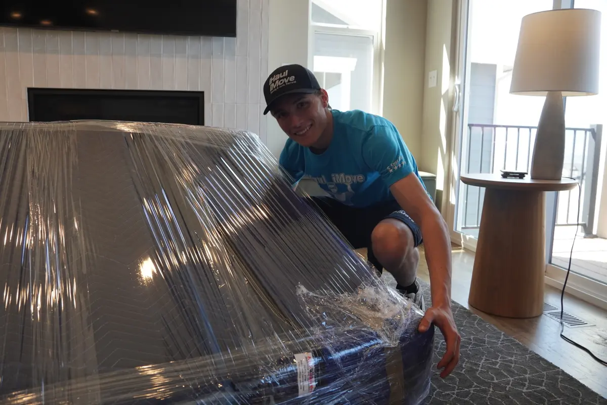 iHaul iMove crew carrying moving boxes in Colorado Springs