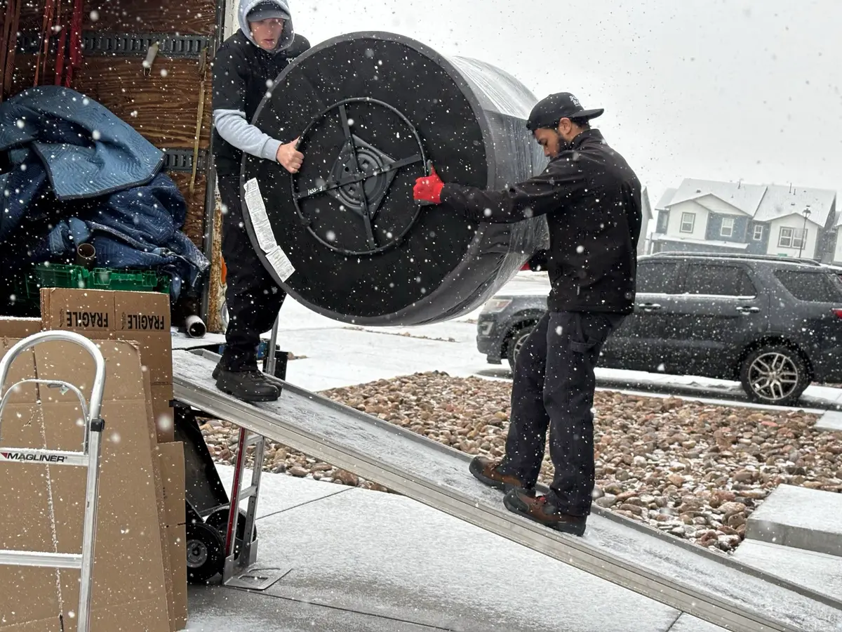 iHaul iMove crew moving furniture in Colorado winter snow