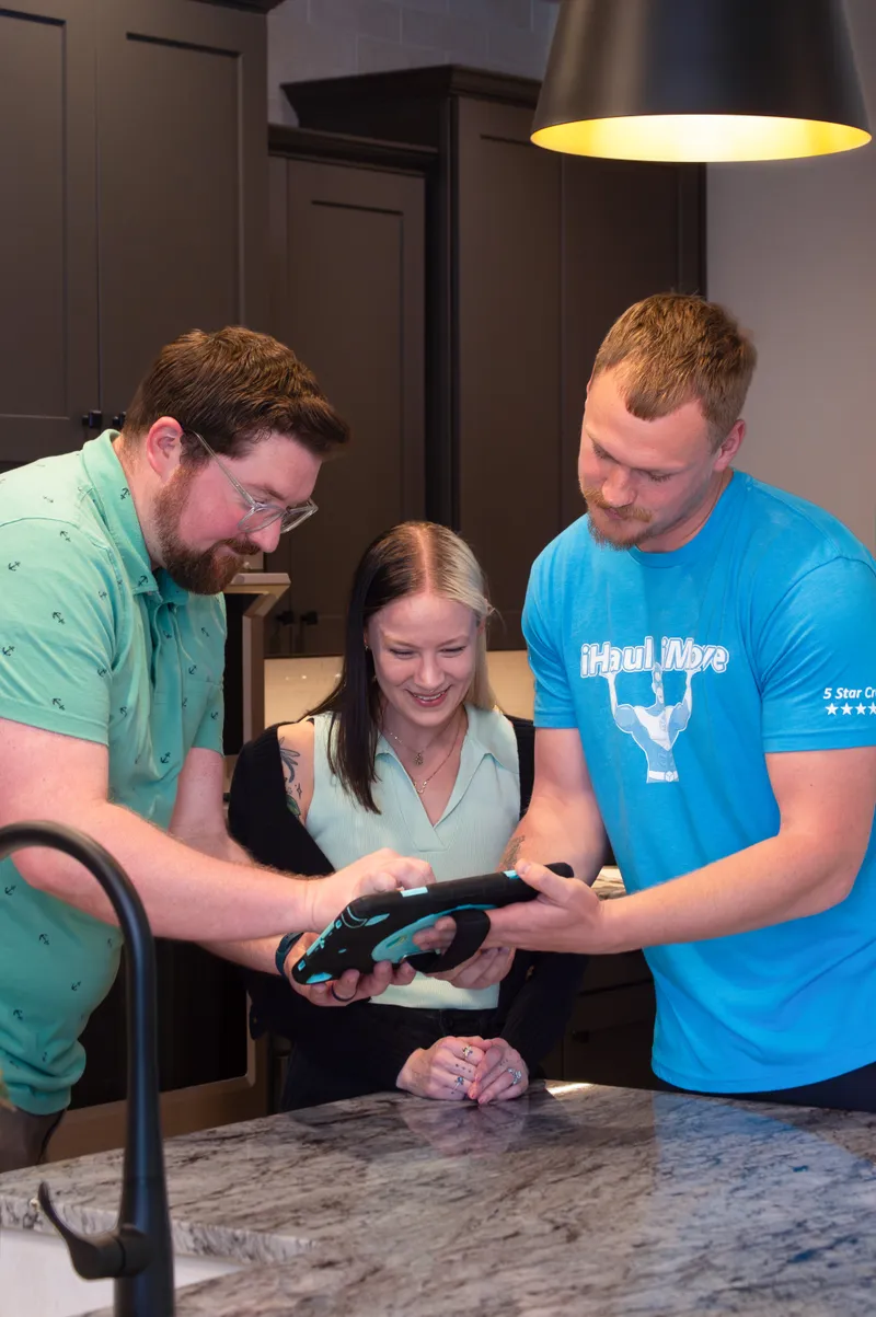 iHaul iMove crew reviewing moving agreement with customer in Sedalia